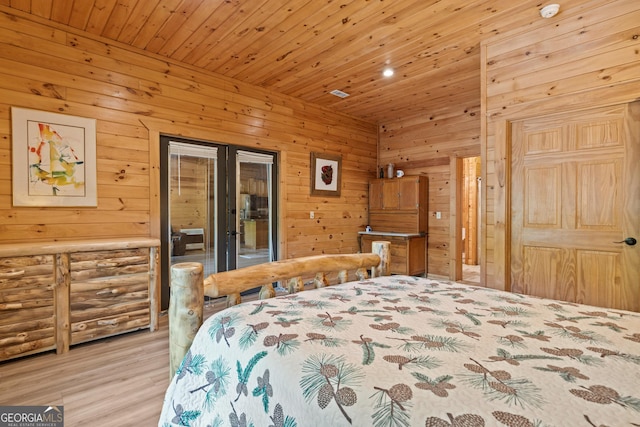 bedroom with wood ceiling, french doors, wood walls, access to outside, and light wood-type flooring