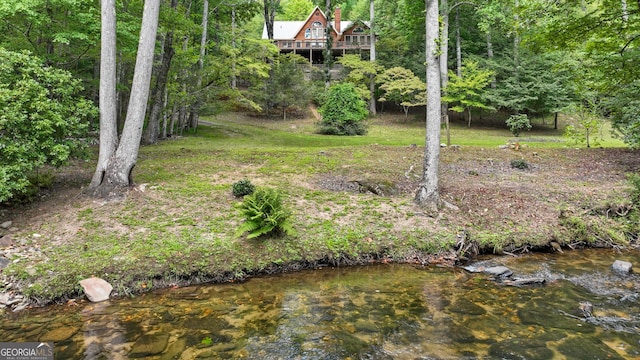 view of yard featuring a view of trees