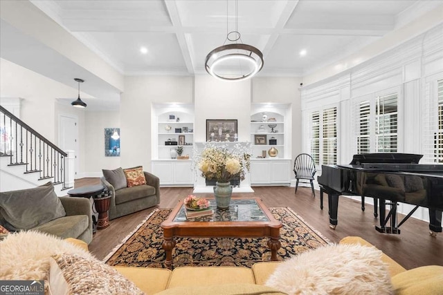 living area with stairway, built in features, wood finished floors, and coffered ceiling