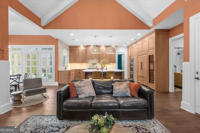 living area featuring recessed lighting, beamed ceiling, high vaulted ceiling, and dark wood finished floors