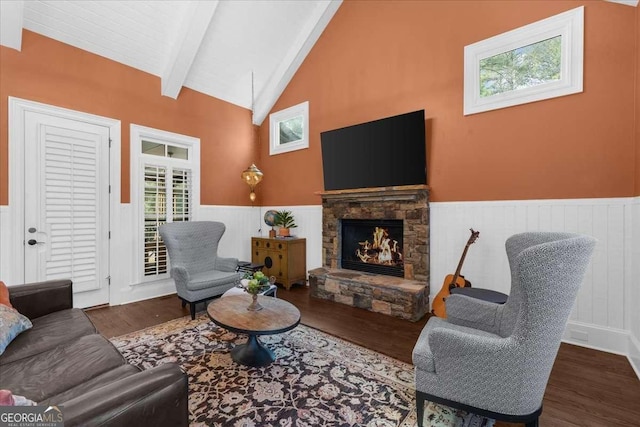135 Newcastle Ct, Roswell, GA 30076 - living area with a wainscoted wall, beamed ceiling, wood finished floors, a stone fireplace, and high vaulted ceiling