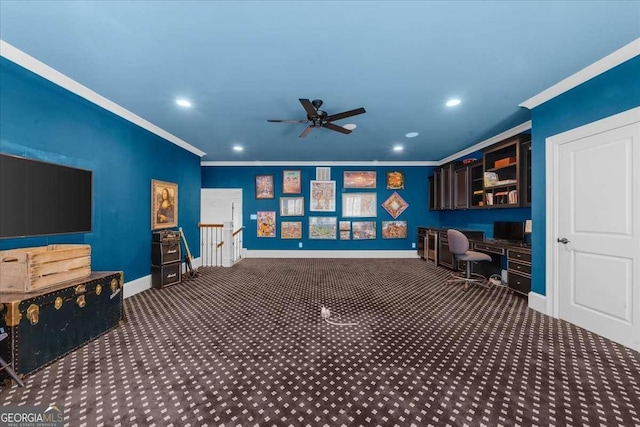 interior space with built in desk, carpet floors, baseboards, and ornamental molding