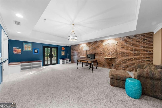 135 Newcastle Ct, Roswell, GA 30076 - carpeted living room with a raised ceiling, brick wall, french doors, and recessed lighting