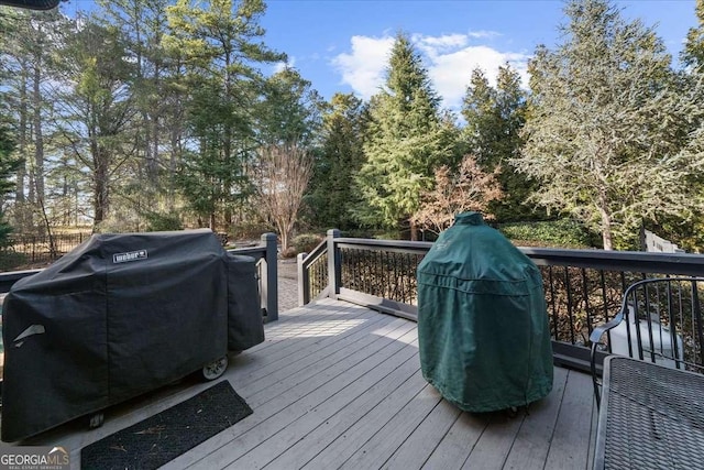 135 Newcastle Ct, Roswell, GA 30076 - deck featuring area for grilling and view of scattered trees