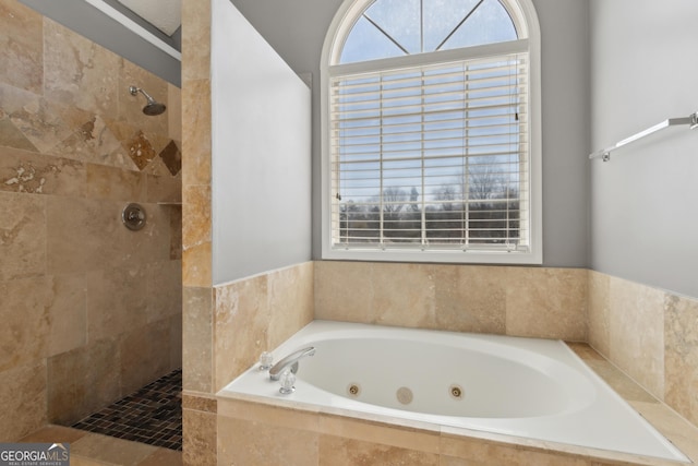 full bathroom featuring tiled shower and a whirlpool tub