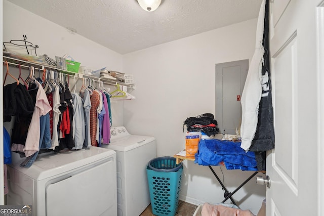 laundry area featuring electric panel, laundry area, independent washer and dryer, and a textured ceiling