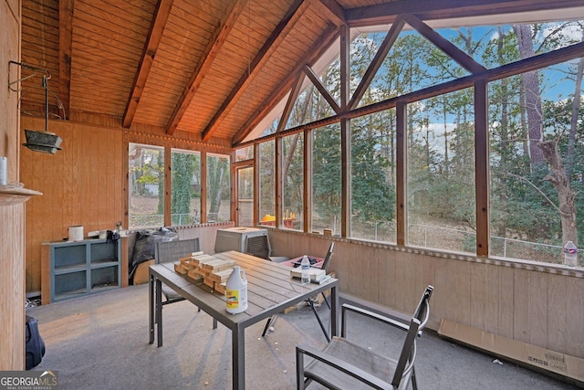 unfurnished sunroom featuring plenty of natural light, wooden ceiling, and lofted ceiling with beams