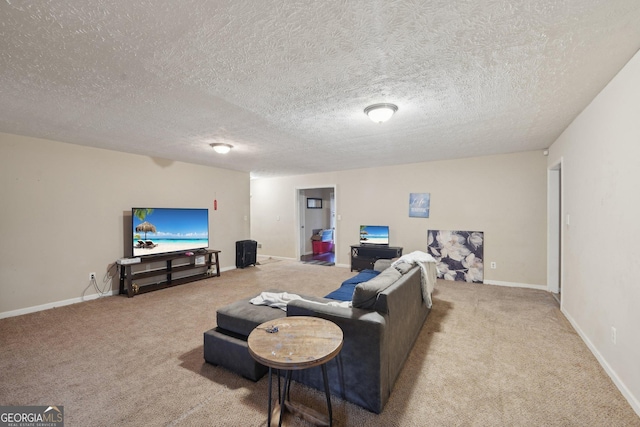 living room featuring baseboards, a textured ceiling, and carpet flooring