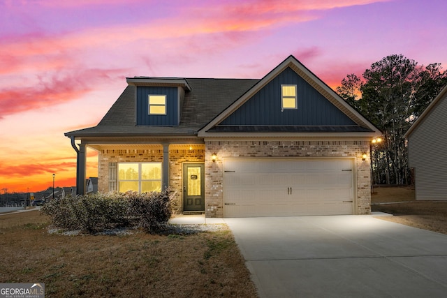 craftsman-style house featuring brick siding, board and batten siding, concrete driveway, and an attached garage