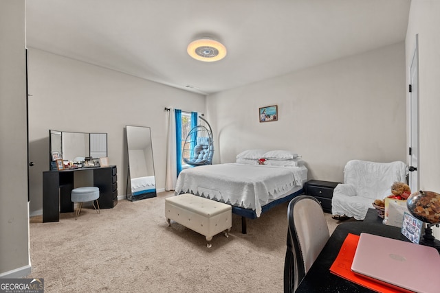 carpeted bedroom with visible vents and baseboards