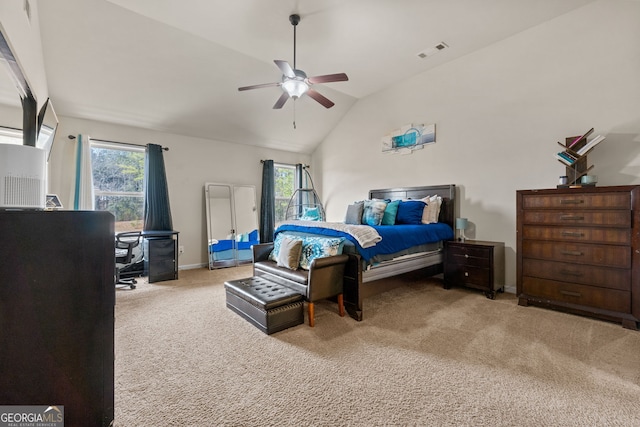 carpeted bedroom with visible vents, a ceiling fan, baseboards, and vaulted ceiling