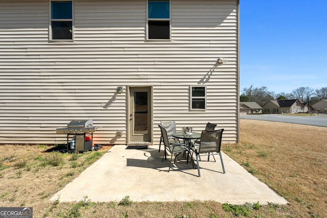 back of house with a patio