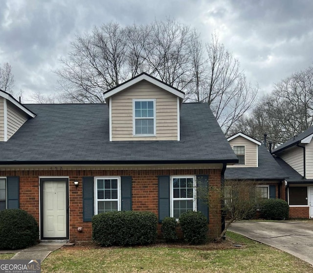 view of front of home featuring brick siding