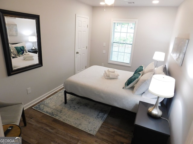 bedroom with visible vents, recessed lighting, wood finished floors, and baseboards