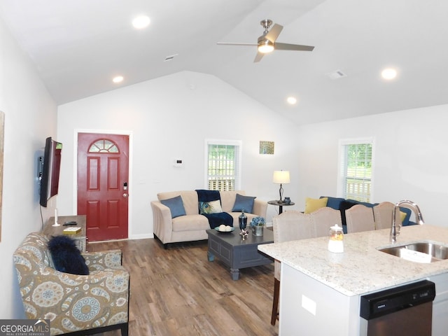 living area with visible vents, lofted ceiling, recessed lighting, wood finished floors, and a ceiling fan