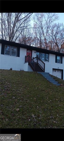 view of front of property with a front lawn and stucco siding