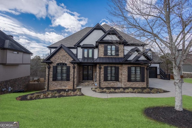 craftsman house with a standing seam roof, roof with shingles, concrete driveway, a front yard, and metal roof