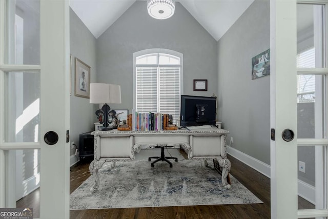 office featuring lofted ceiling, a healthy amount of sunlight, and wood finished floors