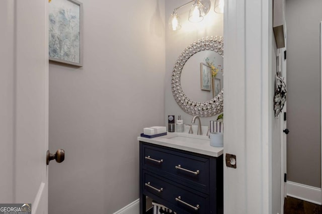 bathroom with vanity and baseboards