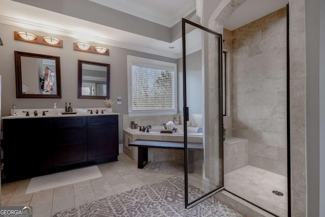 bathroom featuring a garden tub, double vanity, tile patterned flooring, a shower stall, and crown molding