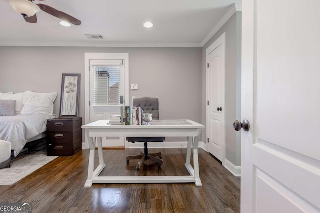 office space with visible vents, crown molding, and wood finished floors