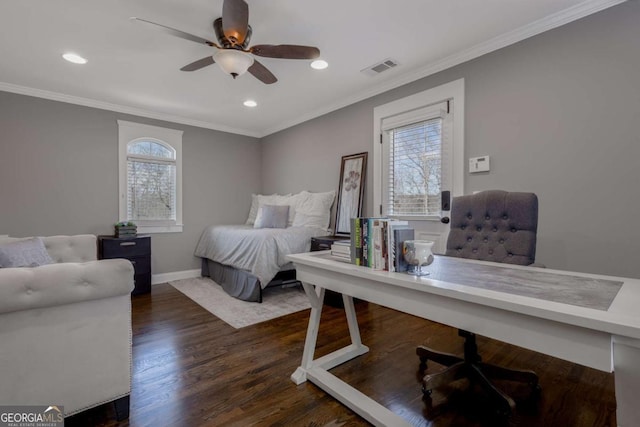 bedroom featuring crown molding, multiple windows, wood finished floors, and visible vents