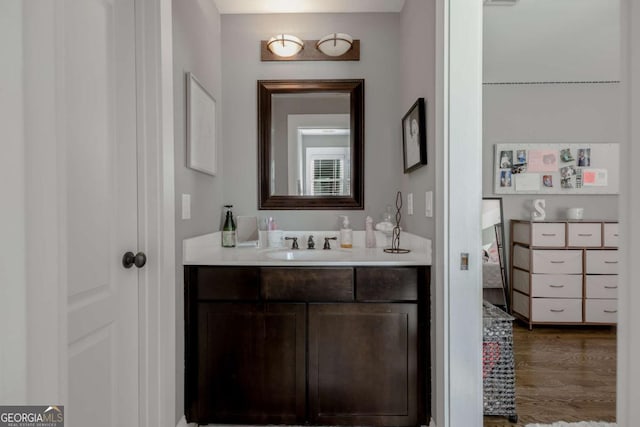 bathroom featuring vanity and wood finished floors