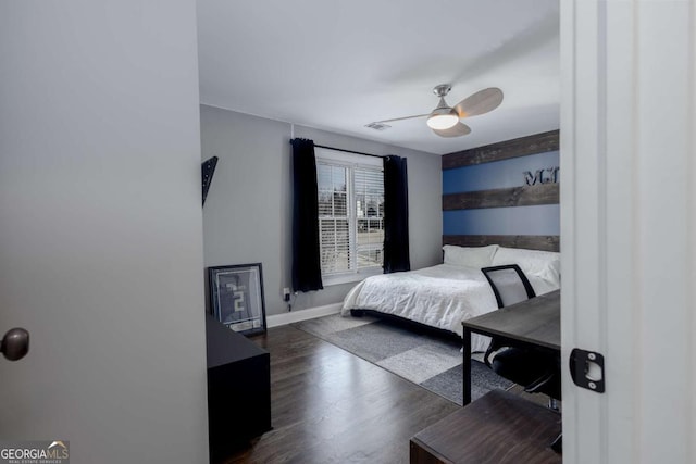 bedroom with a ceiling fan, baseboards, visible vents, and dark wood-style flooring