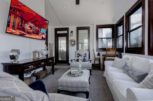 living area featuring vaulted ceiling and carpet floors