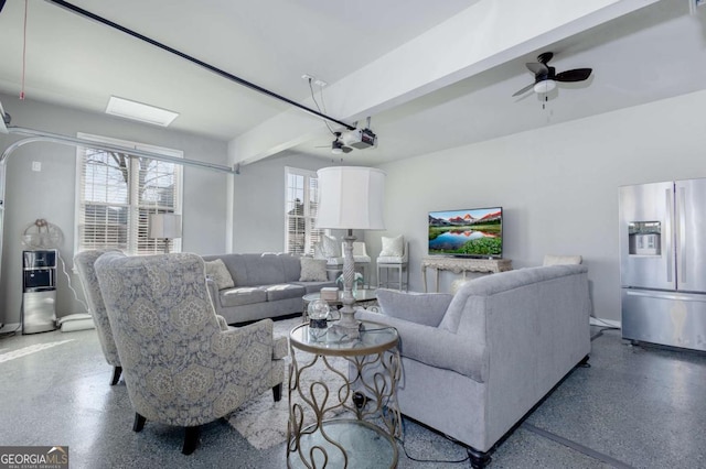 living room featuring speckled floor and ceiling fan