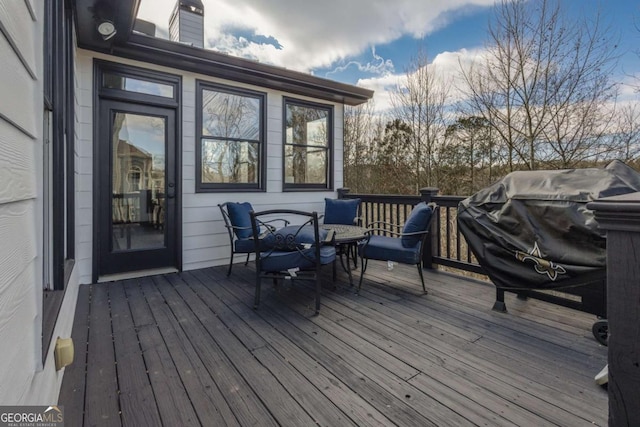 wooden deck with outdoor dining area