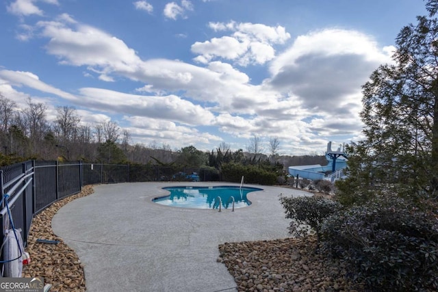 view of swimming pool with a fenced in pool, a patio, and fence