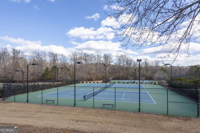 view of sport court with fence