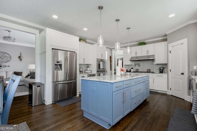 kitchen with under cabinet range hood, white cabinets, appliances with stainless steel finishes, and crown molding