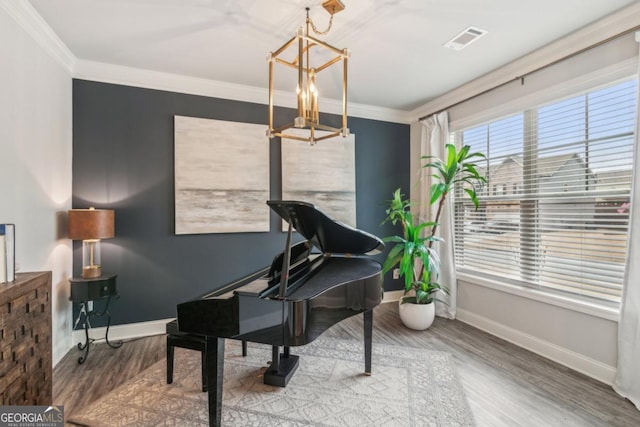 6902 Lancaster Xing, Flowery Branch, GA 30542 - living area featuring an inviting chandelier, baseboards, wood finished floors, and visible vents