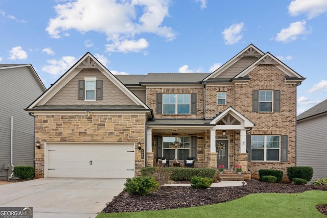 craftsman inspired home with brick siding and concrete driveway