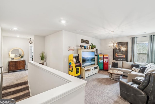 living area with a chandelier, recessed lighting, and carpet