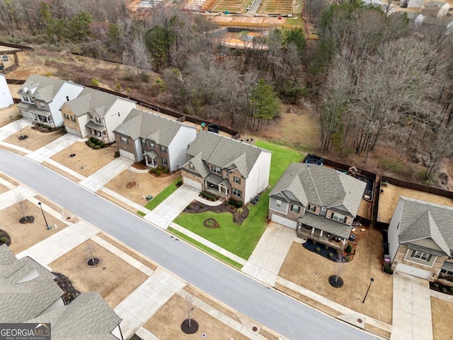 birds eye view of property with a residential view