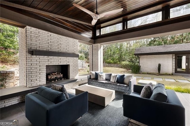 view of patio featuring a gazebo and an outdoor living space with a fireplace