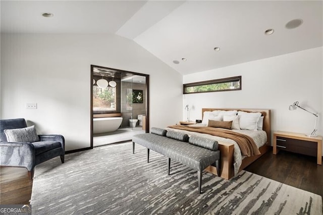 bedroom with lofted ceiling and wood finished floors