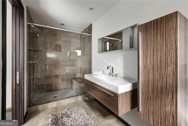 bathroom with vanity and a shower stall