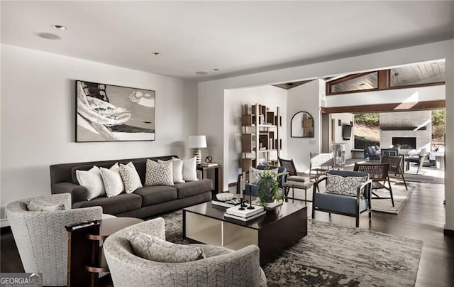 living room featuring wood finished floors and a fireplace