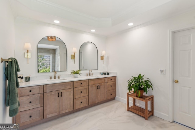 bathroom with a sink, double vanity, recessed lighting, and crown molding