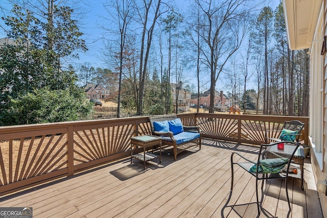 wooden terrace featuring outdoor lounge area