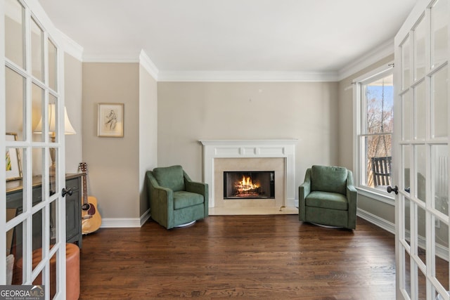 living area featuring dark wood-style floors, french doors, and crown molding