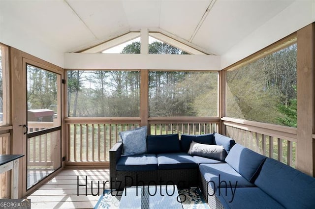 sunroom / solarium with lofted ceiling