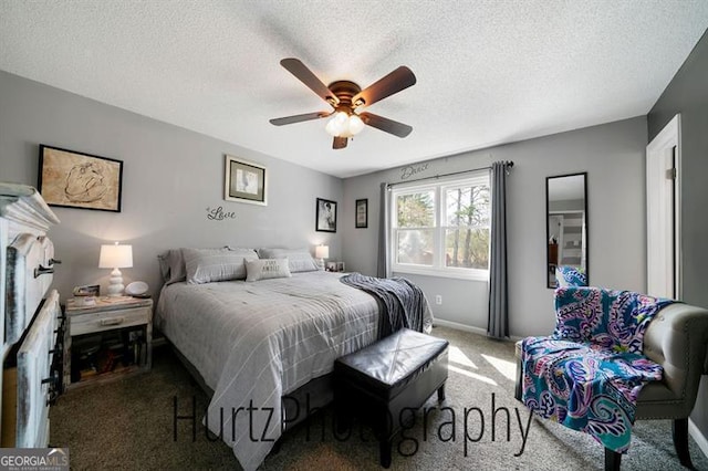 bedroom with carpet flooring, a ceiling fan, baseboards, and a textured ceiling