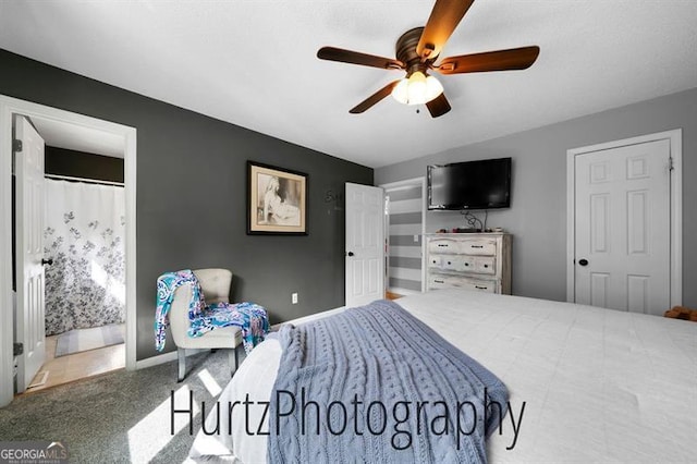 bedroom featuring speckled floor, baseboards, and ceiling fan