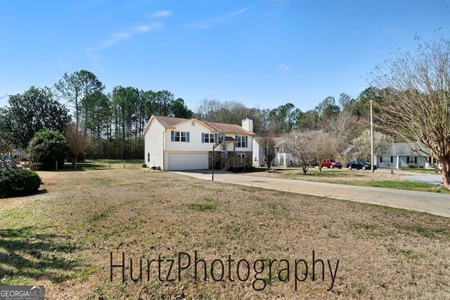 exterior space featuring an attached garage and driveway