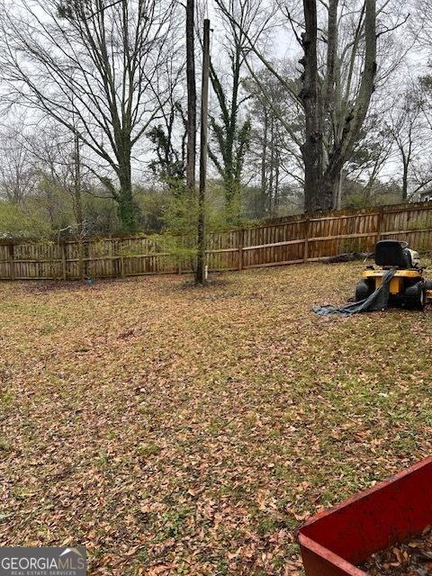 view of yard with a fenced backyard